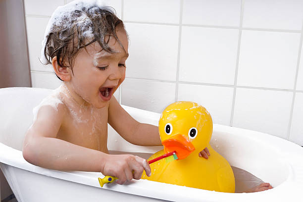 istock Toddler brushing theeth in a bathtub 531609955
