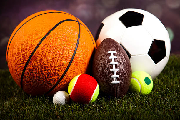 istock Assorted sports equipment and grass 531610573