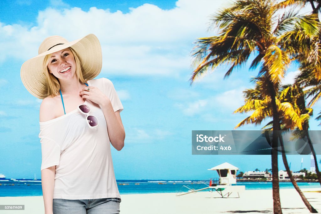 Cheerful woman in front of beach Cheerful woman in front of beachhttp://www.twodozendesign.info/i/1.png 20-29 Years Stock Photo