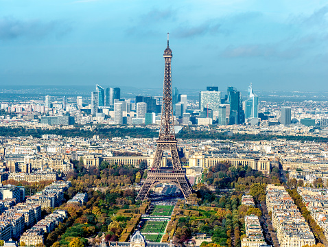 The Eiffel Tower (French: La tour Eiffel) is an iron lattice tower located on the Champ de Mars in Paris (7th arrondissement). The tower is 324 metres (1,063 ft) tall about the same height as an 81-storey building. It was named after the engineer Gustave Eiffel, whose company designed and built the tower. The tower is the tallest structure in Paris and the most-visited paid monument in the world.