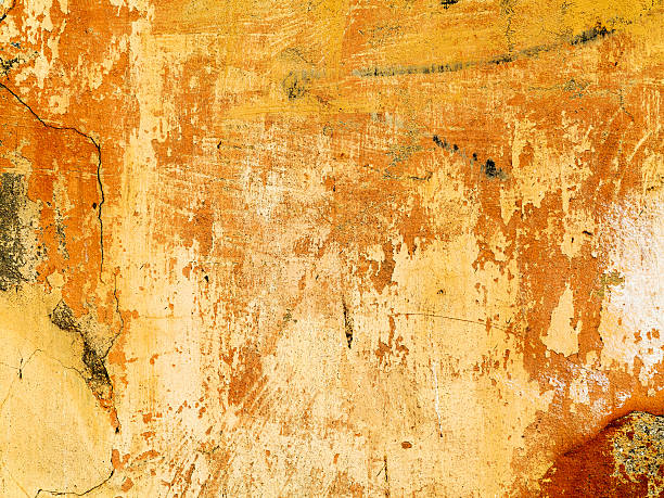 istock Concrete, weathered, worn, painted yellows. Landscape style. Gru 531612177