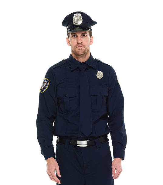 police debout et regardant l'objectif - mid adult men portrait hat human face photos et images de collection