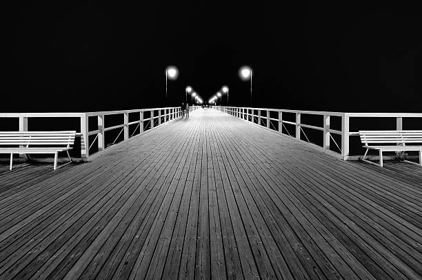 istock Benches and lamp posts on a pier 531613895