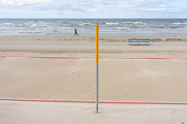 istock Man running along the deserted beach 531614193