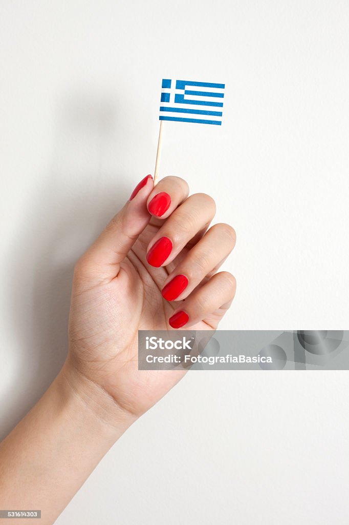 Sosteniendo bandera griega - Foto de stock de 2015 libre de derechos
