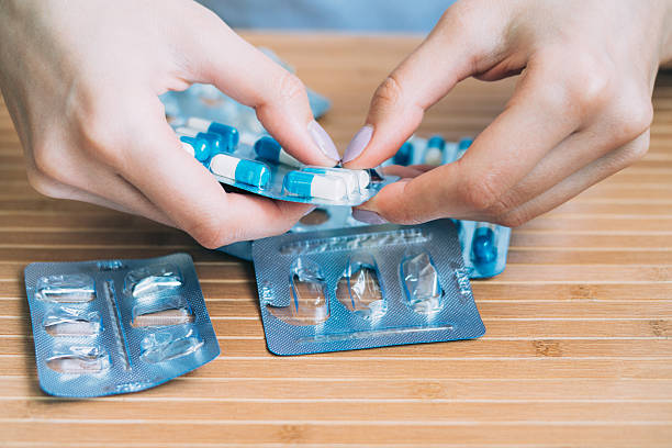 istock Female hands take out the tablet from the blister 531617282