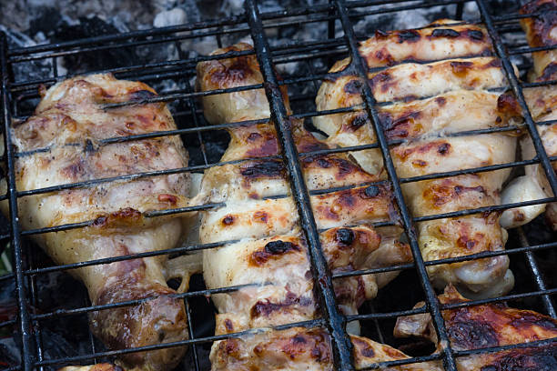 istock chicken legs on the grill 531619794