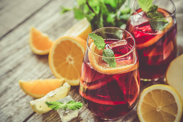 Sangria and ingredients in glasses stock photo