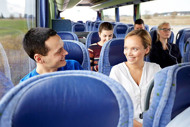 grupo de felices pasajeros en autobús de viaje - autocar fotos fotografías e imágenes de stock