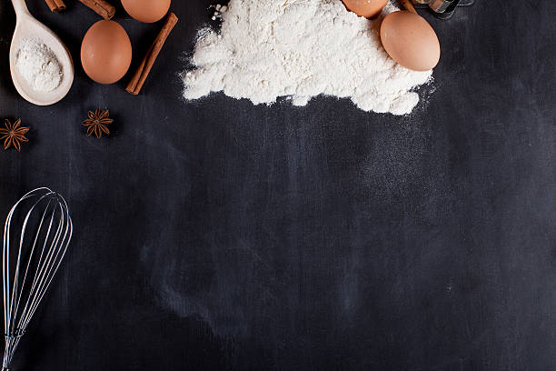 istock Ingredients for baking cookies on blackboard from the top 531623378