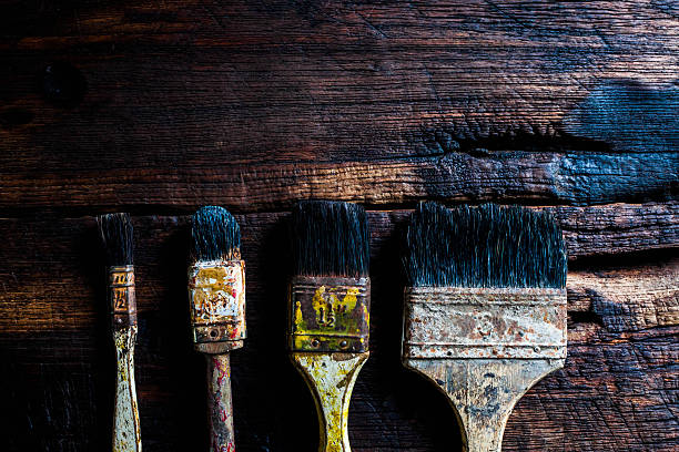 istock Old grungy paint brushes on the wood 531624042