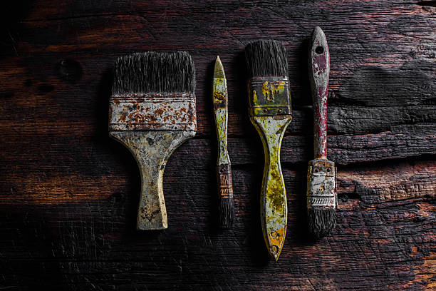 istock Old grungy paint brushes on the wood 531624202