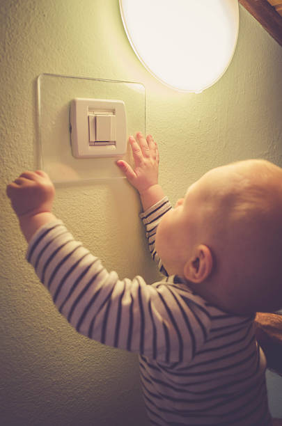 istock Baby child switching on / off the light 531624254