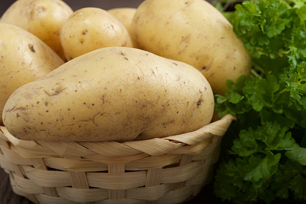 istock potatoes on a wooden background 531624546
