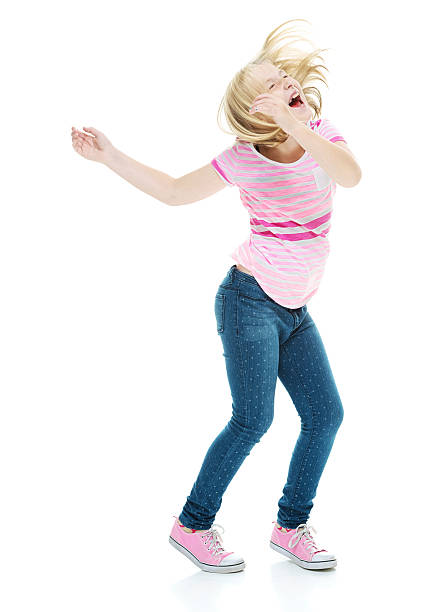 teenager girl dancing isolated on white