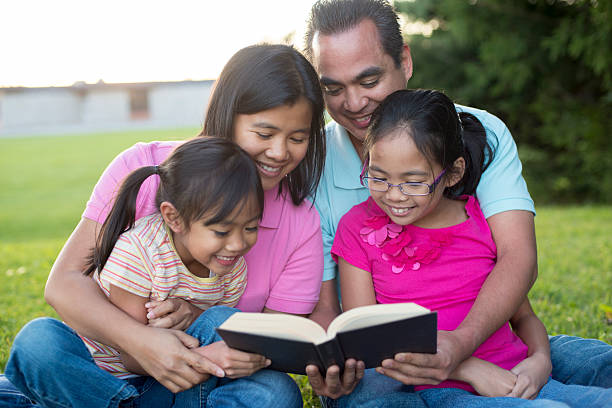 istock Reading the Bible in the Park 531625230