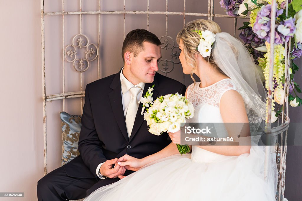 nice young wedding couple nice young wedding couple in white interior Adult Stock Photo