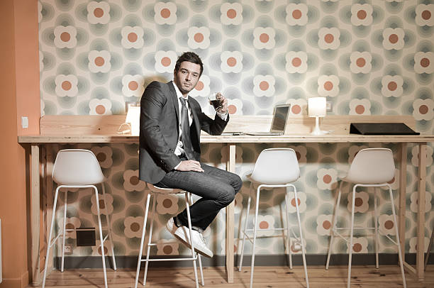 istock Handsome business man in restaurant talking on the phone 531626174