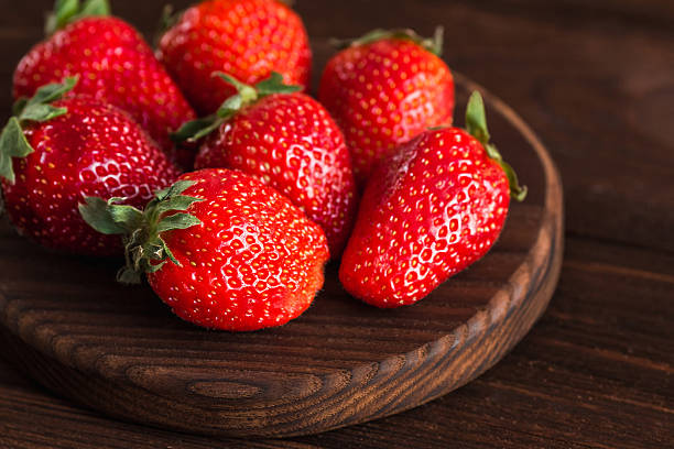 istock strawberry on the cutting board on wooden background 531626550