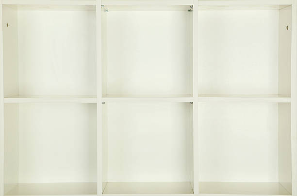 istock Empty shelves in white wooden rack, close up 531626878