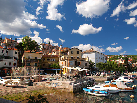 Volosko, Croatia - April 15, 2014: Wide angle shot of picturesque fishing village near Opatija, Croatia.