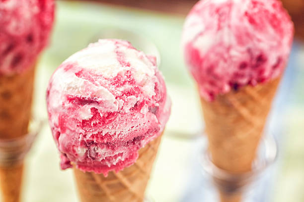 Delicious strawberry ice cream in a cone. This creamy delicious ice cream is a perfect treat on a sunny day.