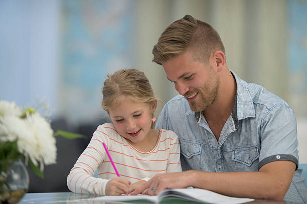 istock Father Helping His Daughter with Her Homework 531629094