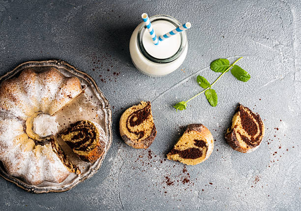 istock Zebra bundt cake cut into peices, milk in bottle and 531629400