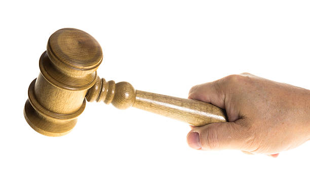 istock Hand gripping a wooden gavel 531630723