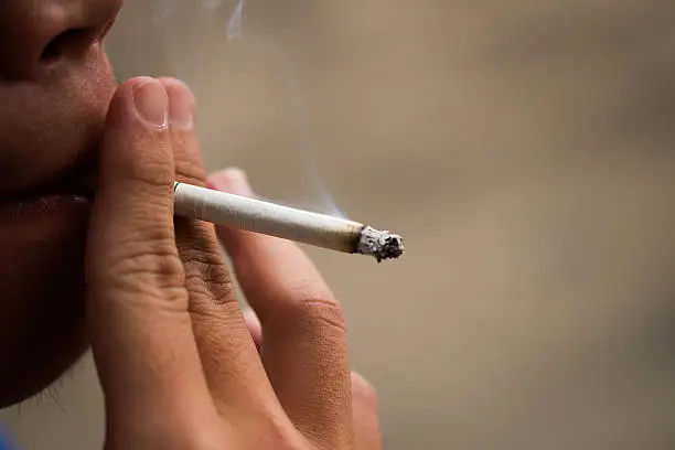 Photo of Asia Man smoking cigarette (Selective focus)