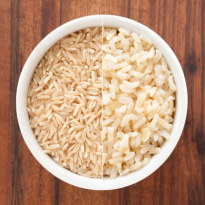 Composite of shots of raw and boiled brown rice in white bowl for process concept