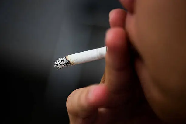 Photo of Asia Man smoking cigarette (Selective focus)
