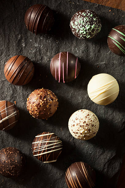Fancy Dark Chocolate Truffles Fancy Dark Chocolate Truffles Ready to Eat chocolate truffle stock pictures, royalty-free photos & images
