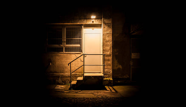 istock Stairs and door illuminated in the night 531631963
