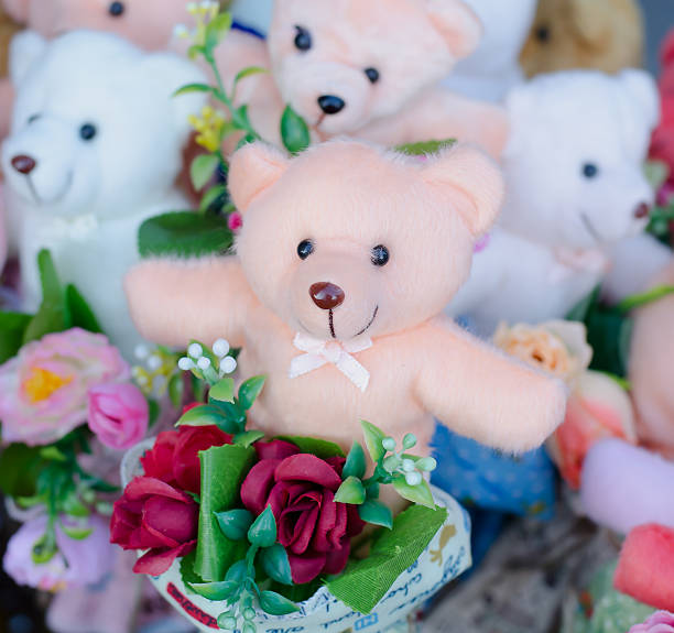 istock Teddy bear hold  bouquet of flowers 531632089