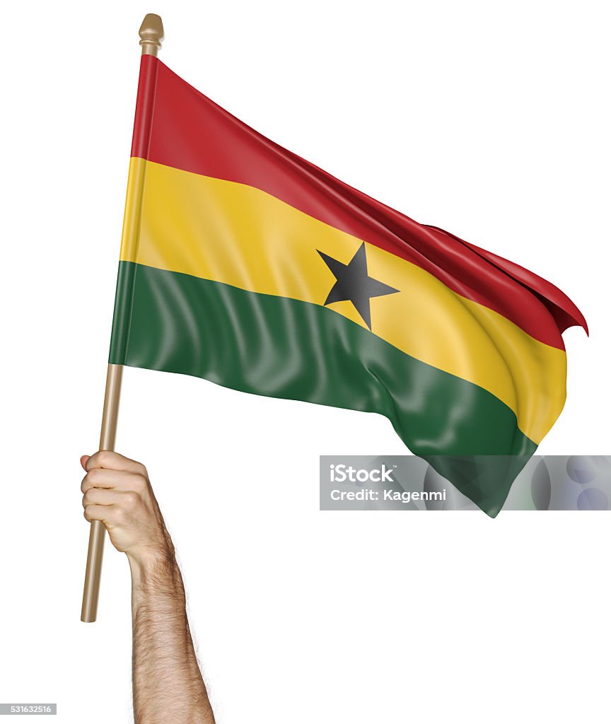 Hand proudly waving the national flag of Ghana Man's hand raising the Ghana national flag high in the air, isolated against a white background. Ghanaian Flag Stock Photo