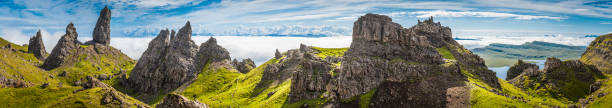 The dramatic rocky pinnacles of The Sanctuary on the Storr in the north of the Isle of Skye high above the clouds covering the ocean below, Highlands, Scotland. ProPhoto RGB profile for maximum color fidelity and gamut.