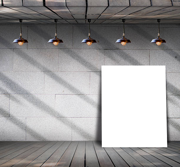 istock Poster standing on wood floor with Grungy concrete wall 531633697