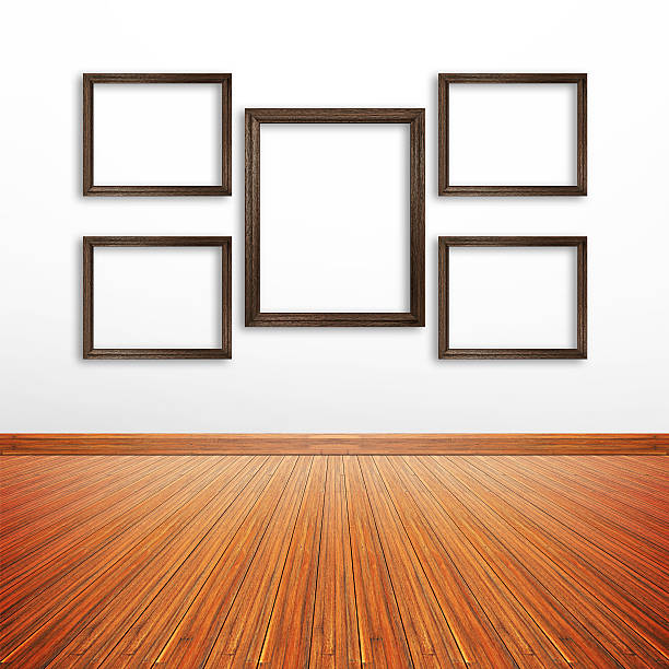 istock Wooden photo frames on white wall inside the room 531639543