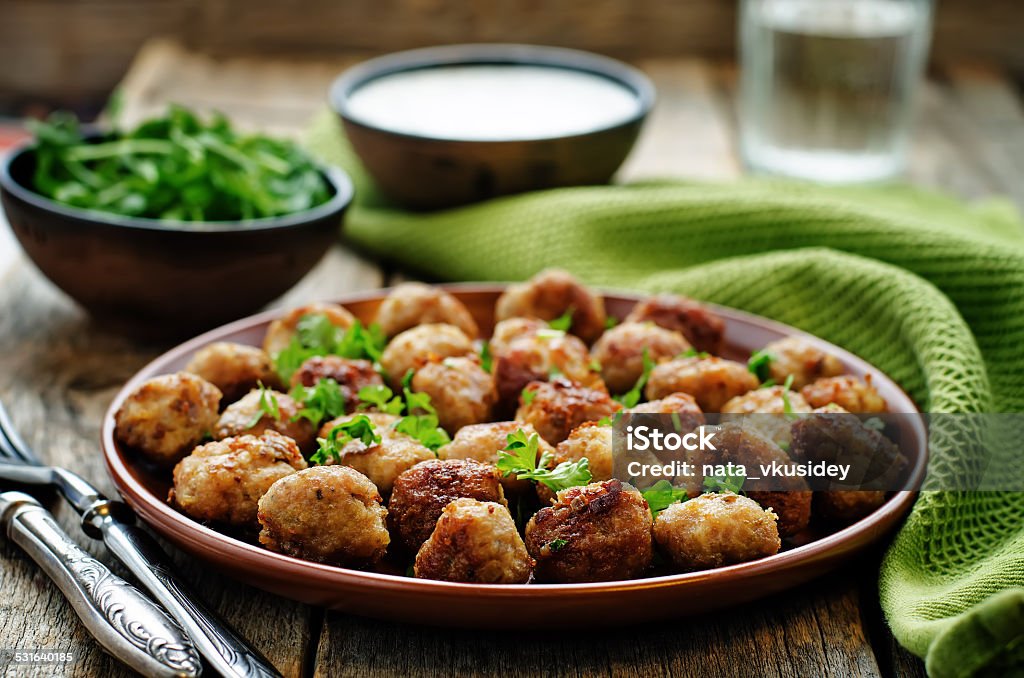 meatballs grilled with parsley meatballs grilled with parsley on a dark wood background. tinting. selective focus 2015 Stock Photo
