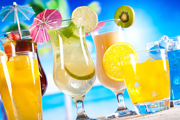 Tropical drinks on beach and sun