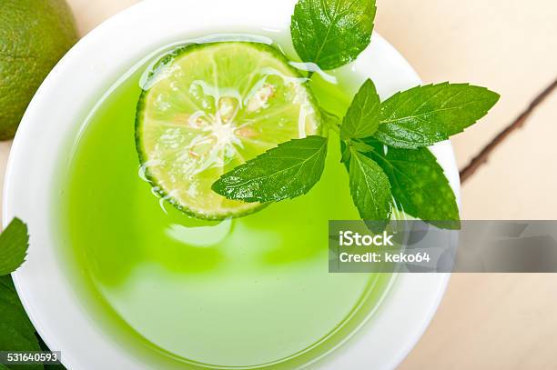 Mint Infusion Tea Tisane With Lime Stock Photo - Download Image Now - 2015, Backgrounds, Brightly Lit