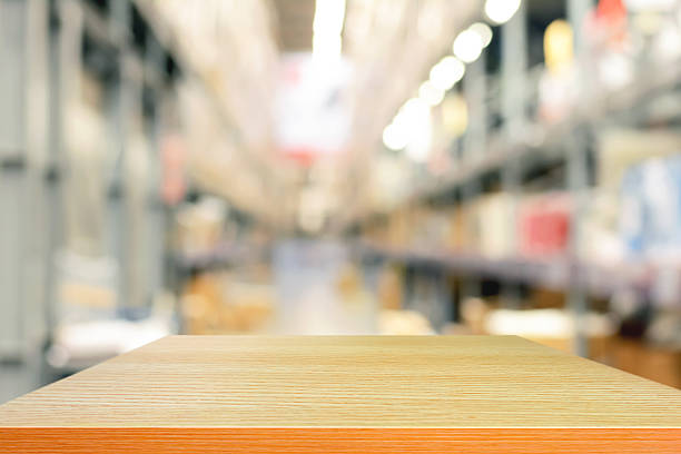 istock Empty wood table top or shelf on blurred warehouse background 531642343