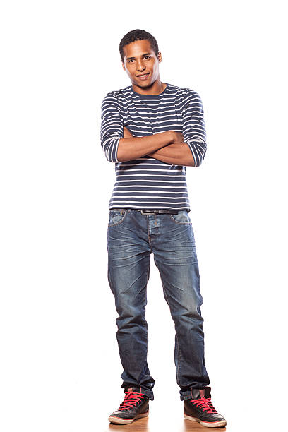 smiling dark-skinned young man in jeans and  blouse
