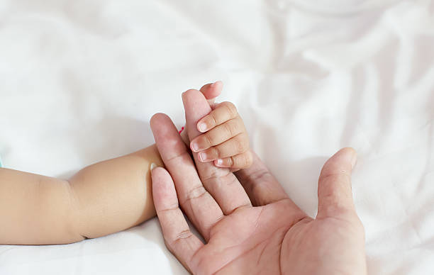 istock Baby 5 months hold your hand father 531644437