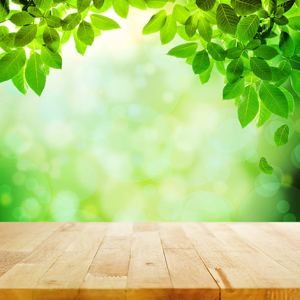 istock Wood table top on nature green abstract background 531645695