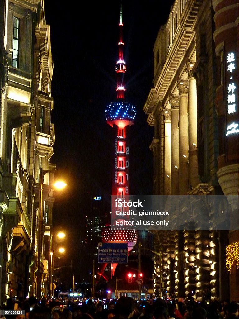 New Year's eve in Shanghai Shanghai, China - December 31, 2014: 2015 New Year's eve crowd counting the secondst waiting the arrival of the new year in front of the beautifully lighten Oriental Pearl Tower  2015 Stock Photo