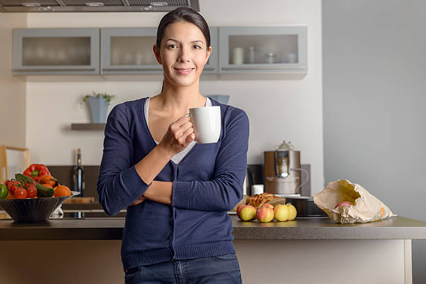 istock Happy contented housewife in her kitchen 531655649