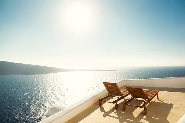 Two empty beach chairs with a magnificent view to the sea.