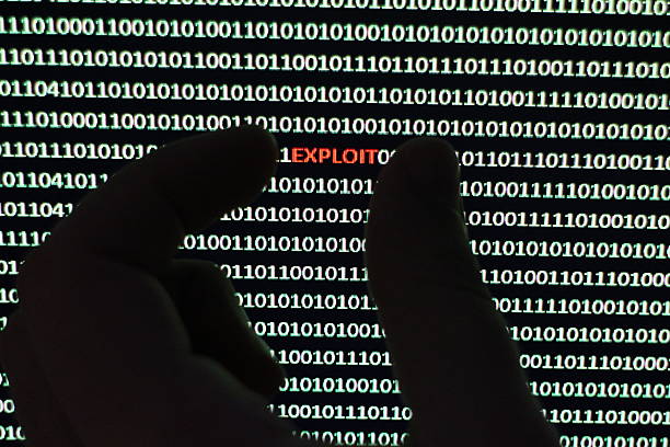 Computer Exploit Photograph depicts a security scanner extracting virus from a string of binary code. exploitation stock pictures, royalty-free photos & images